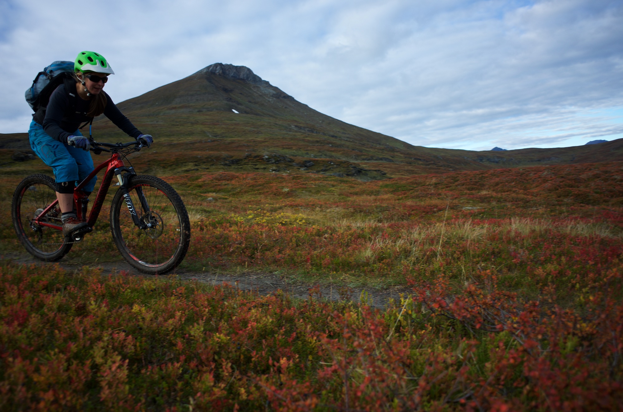 Linnea enjoying the more mellow riding below the summit.