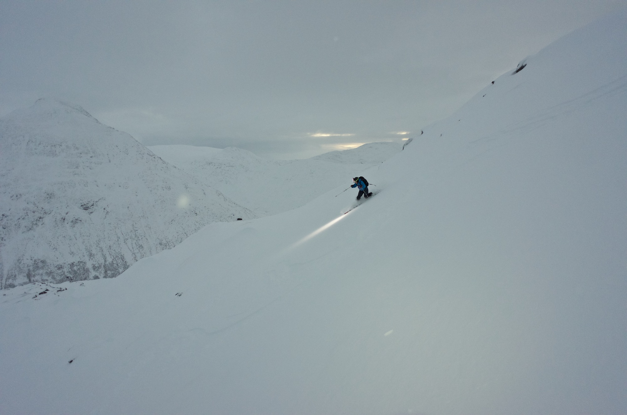 Linnea getting her first turns of the season in what can only be described as both dim and flat light.