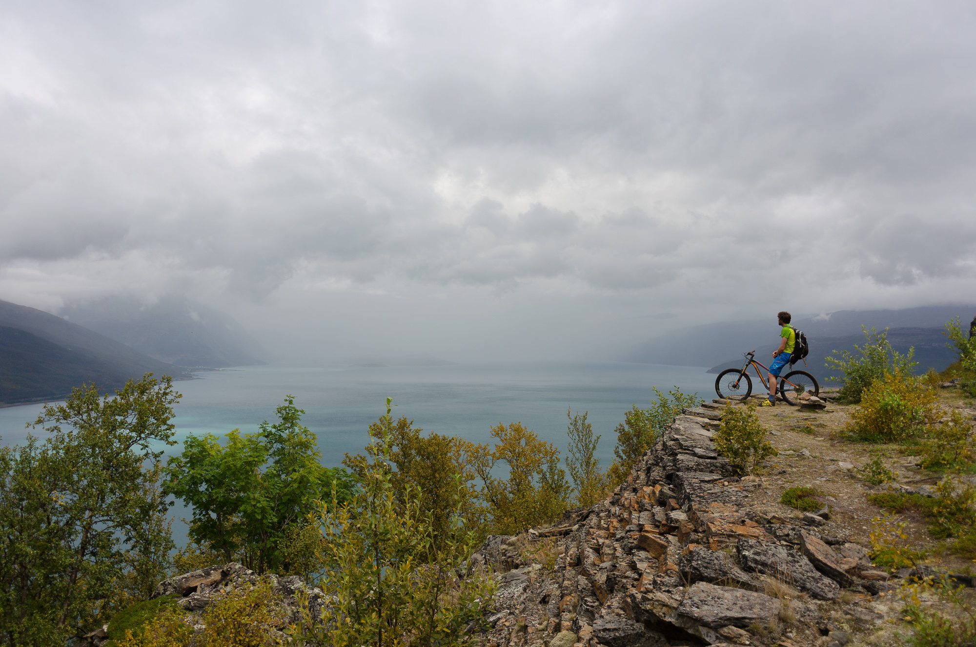 Kjetil looking out over Storfjord from where there probably has been a huge cannon or something.